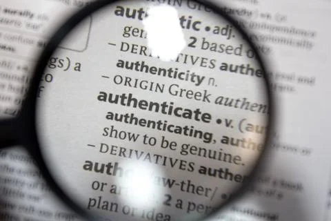 The word of phrase - authenticate - in a dictionary. Stock Photos