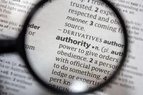 The word of phrase - authority - in a dictionary. Stock Photos