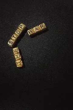 The word is placed on the table from cubes of letters, war Stock Photos