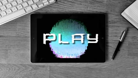 Word PLAY on a tablet screen put on a desk at work, music, watching, game Stock Footage 119294569