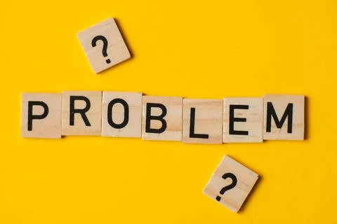 The word problem on a yellow background with question marks. The concept of.. Foto stock