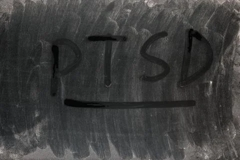 The word PTSD - post traumatic stress disorder handritten on full frame Stockfoto's