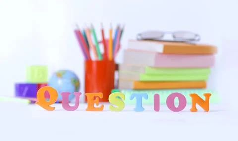 Word question on blurred background of school supplies .photo wi 스톡 사진