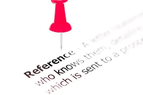 Word REFERENCE  pinned on white paper with red pushpin Stock Photos