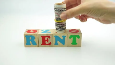 The word rent is made of cubes. And banknotes dollars and euros Stock Footage 149136286