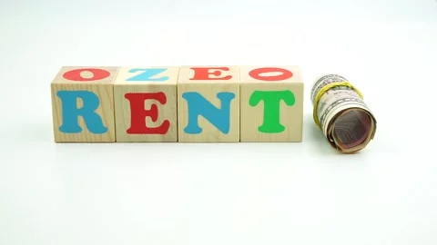 The word rent is made of cubes. And banknotes dollars and euros Stock Footage 149136295