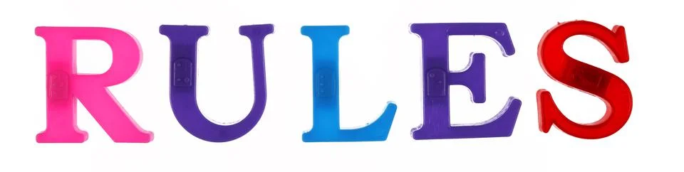 The word rules is lined with multicolored plastic letters isolated Foto stock