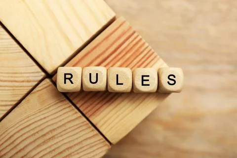 Word Rules made of cubes with letters on wooden blocks, top view Foto stock