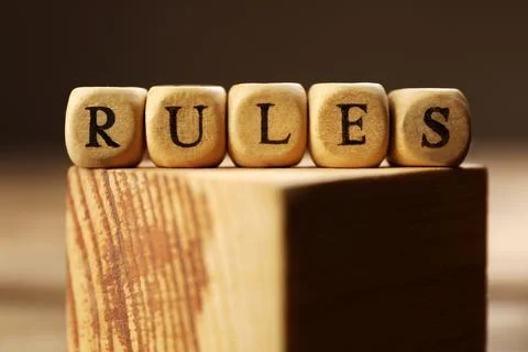 Word Rules made of cubes with letters on wooden block, closeup Foto stock