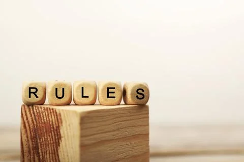 Word Rules made of cubes with letters on wooden block, space for text 写真素材