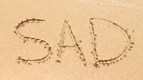 The word sad on the sand Stock Footage 64211965