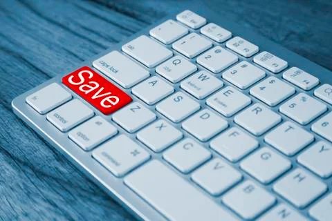 The word 'save' highlighted  on one key, allowing us all to remember. Stock Photos