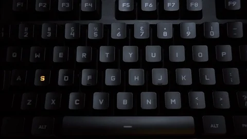 The word school is typed on a luminous computer keyboard. Black backlit keyboard Stock Footage 118277132