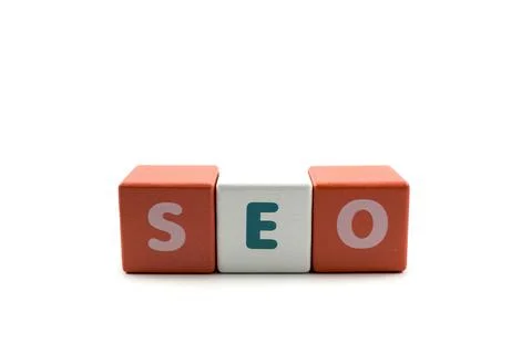Word Search Engine Optimization SEO written on wooden cubes Stock Photos