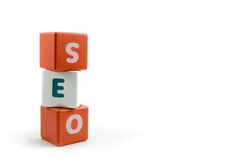 Word Search Engine Optimization SEO written on wooden cubes Stock Photos