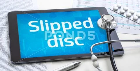 The word Slipped dis on the display of a tablet Stock Photos