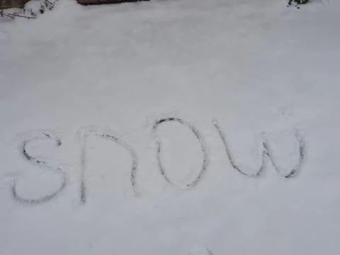 The word "snow" written in the snow Stock Photos