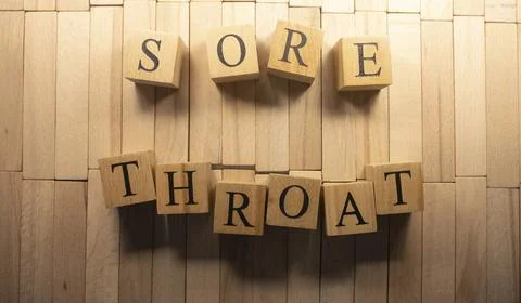 The word sore throat was created from wooden cubes. Health and life. Close up Stock Photos