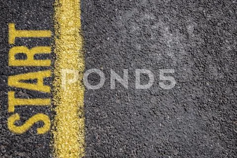 Word Start written on an asphalt road background Stock Photos