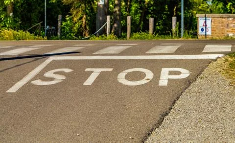 The word stop on a paved road Foto stock