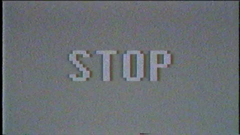 The word STOP on the screen with gray noise. Digital animation with binary code Stock Footage 113038944