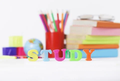 Word study on blurred background of school supplies .photo with copy space Foto stock