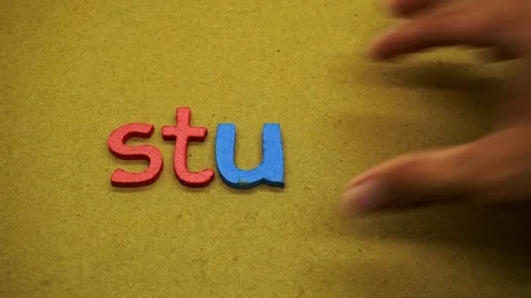 The word study spelled with colorful textured craft letters on brown paper .. Stock Footage 345127714