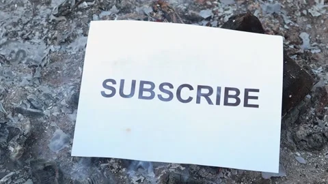 Word Subscribe on a white sheet of paper burns into a fire against. Slow motion Vídeo Stock 142588896