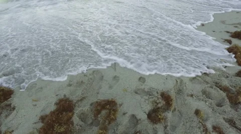 The word Summer being washed away by the tide on a beach Stock Footage 45274620
