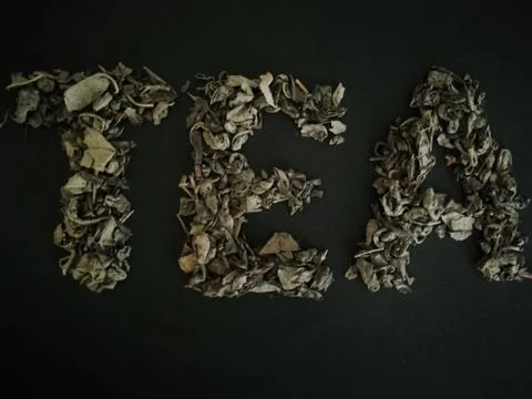 The word tea is presented from the tea itself.Green tea. Stock Photos