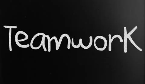The word "teamwork" handwritten with white chalk on a blackboard Stock Illustration