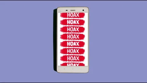 Word text Hoax written on screen of white smartphone. Stop motion animation Stock Footage 220656921