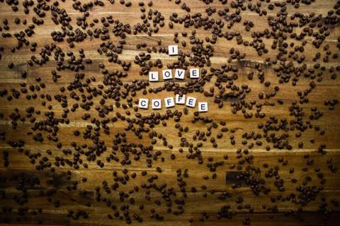 Word Tiles I love Coffee Staggered Coffee Beans Timber Background Stock Photos