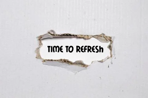 The word time to refresh appearing behind torn paper Stock Photos