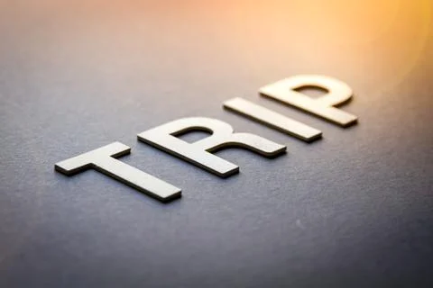 Word trip written with white solid letters Stock Photos