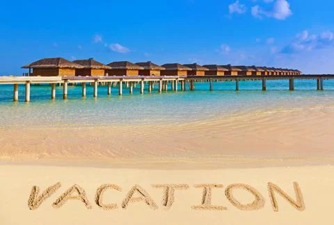 Word Vacation on beach Stock Photos
