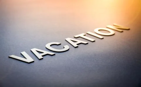 Word vacation written with white solid letters Foto stock