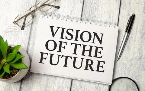 Word Vision Of The Future on notepad and wooden background Stock Photos
