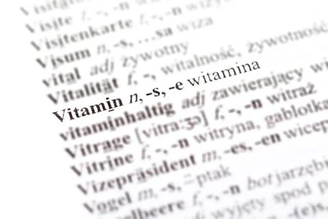 Word vitamin - witamina in a Polish - German dictionary line pointed out Stock Photos