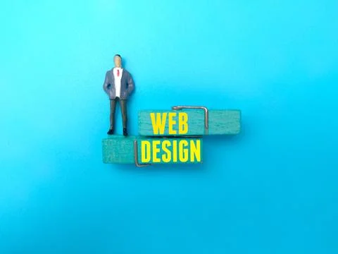The word WEB DESIGN on blue background. Stock-Fotos