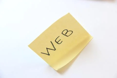 Word WEB written on yellow note page. WEB design development. Stock Photos