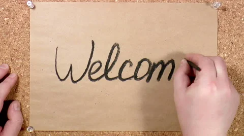 Word Welcome written on paper Stock Footage 48951653