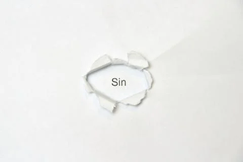 Word on white isolated background through the wound hole in the paper. Stock Photos