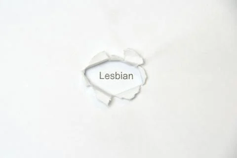Word on white isolated background through the wound hole in the paper. Foto stock