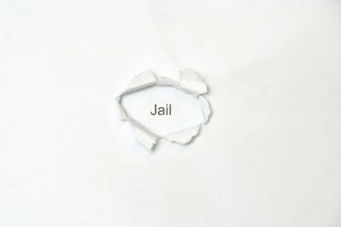 Word on white isolated background through the wound hole in the paper. Stock Photos