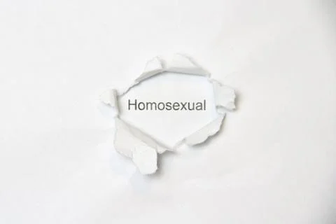 Word on white isolated background through the wound hole in the paper. Stock Photos
