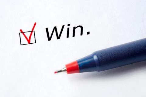 The word win is printed on a white background. Stock Photos
