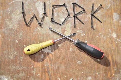 Word work made of screws and two screwdraveers Stock Photos