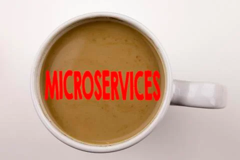 Word, writing Microservices text in coffee in cup. Business concept for Micro Stock Photos