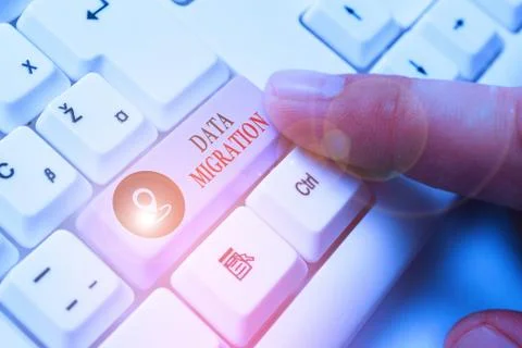 Word writing text Data Migration. Business concept for process of transferring Stock Photos